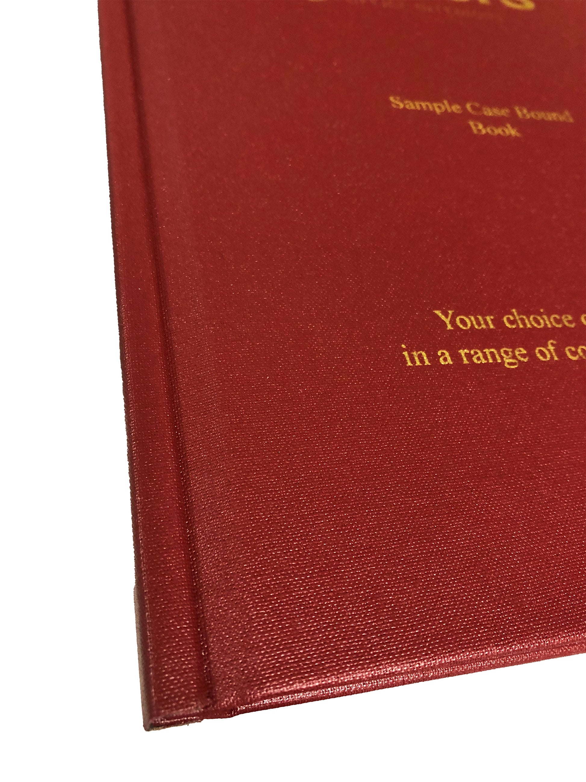Colseup of Red buckram covered thesis with gold crest and gold lettering